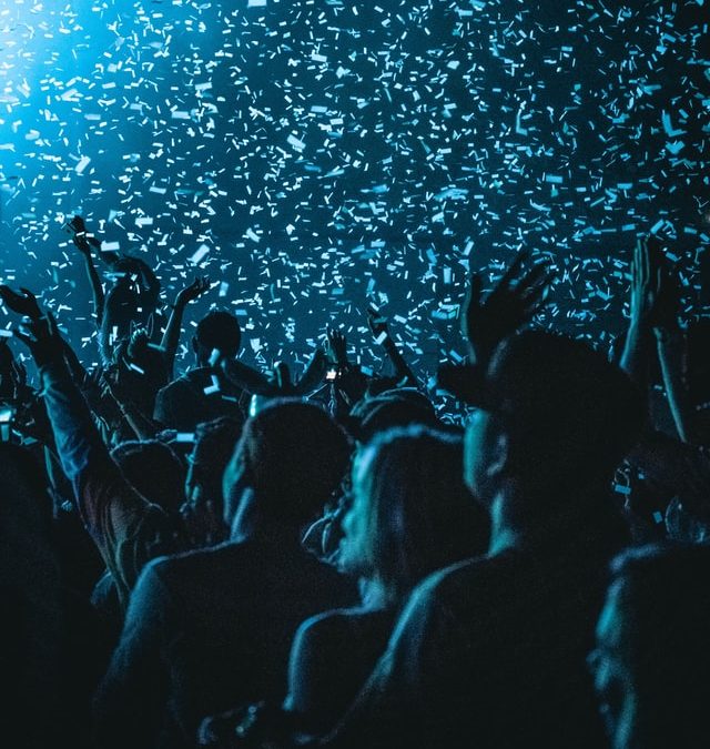 Audience of a live concert under confetti