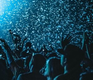 Audience of a live concert under confetti