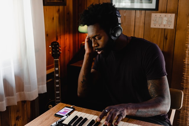 Musician editing music in electronic keyboard