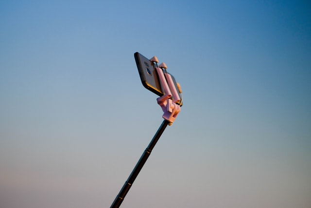 Cellphone held by a selfie stick